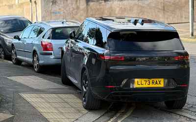 LL73 RAX, a Black Land Rover Range Rover parked in Hollingdean