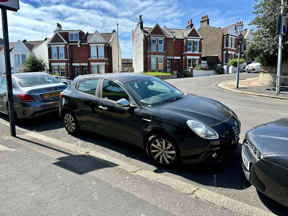 Photograph of VU15 KNV - a Black Alfa Romeo Giulietta parked in Hollingdean by a non-resident. The seventeenth of thirty-four photographs supplied by the residents of Hollingdean.