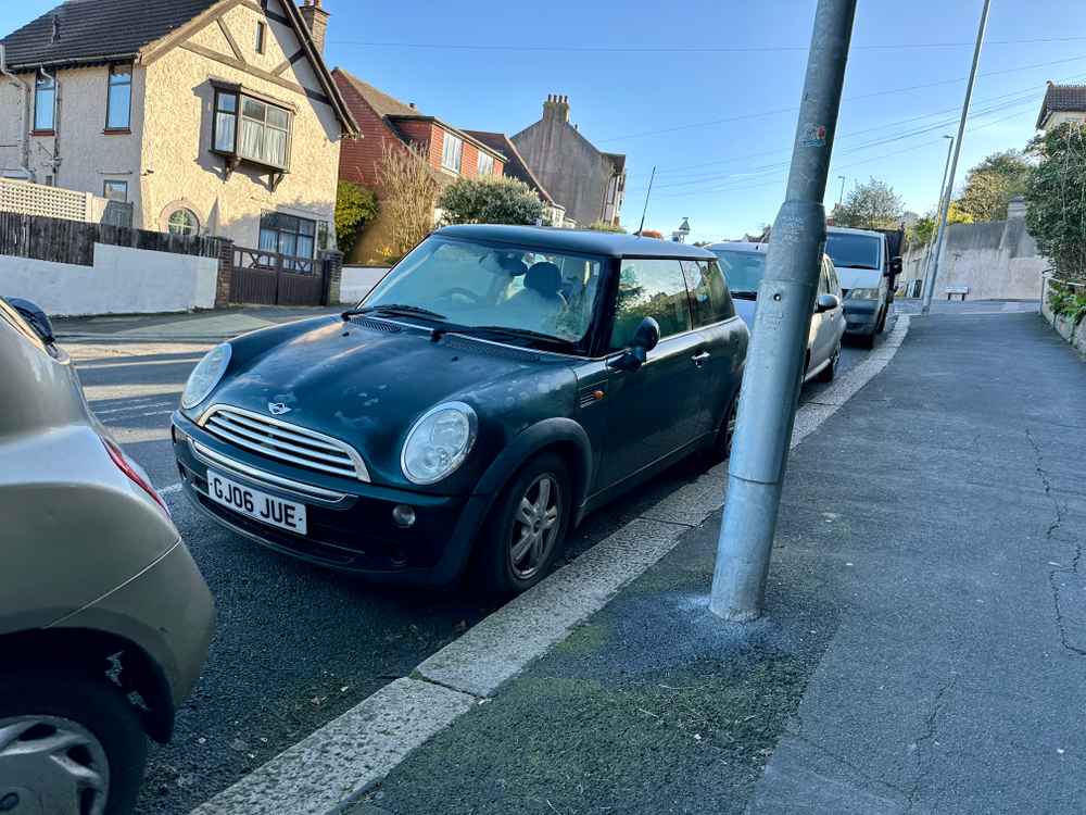 Photograph of GJ06 JUE - a Green Mini Cooper parked in Hollingdean by a non-resident. The eighth of fourteen photographs supplied by the residents of Hollingdean.