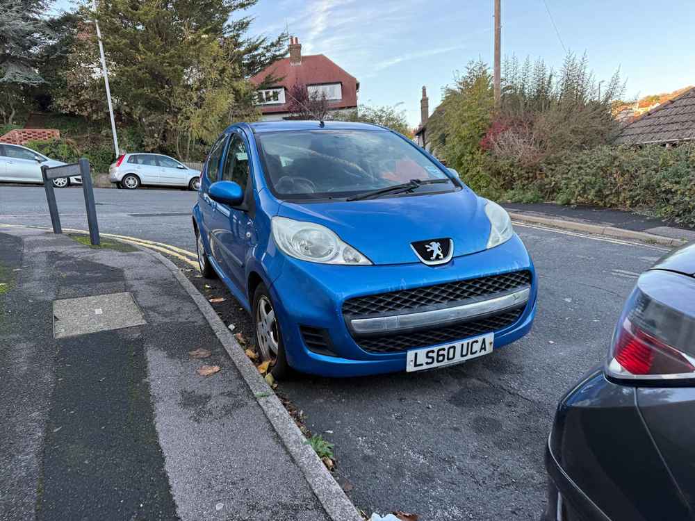 Photograph of LS60 UCA - a Blue Peugeot 107 parked in Hollingdean by a non-resident. The twenty-eighth of thirty photographs supplied by the residents of Hollingdean.