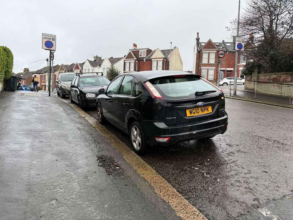 Photograph of WG10 NPK - a Black Ford Focus parked in Hollingdean by a non-resident. The ninth of seventeen photographs supplied by the residents of Hollingdean.