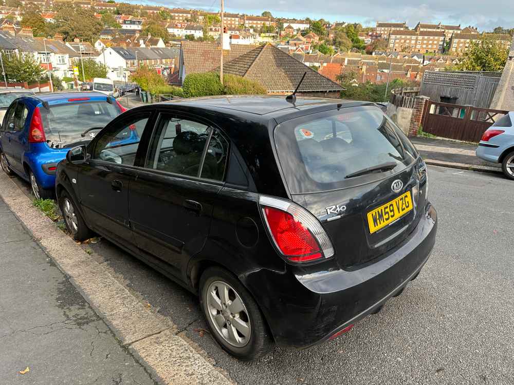 Photograph of WM59 VZG - a Black Kia Rio parked in Hollingdean by a non-resident. The second of eight photographs supplied by the residents of Hollingdean.