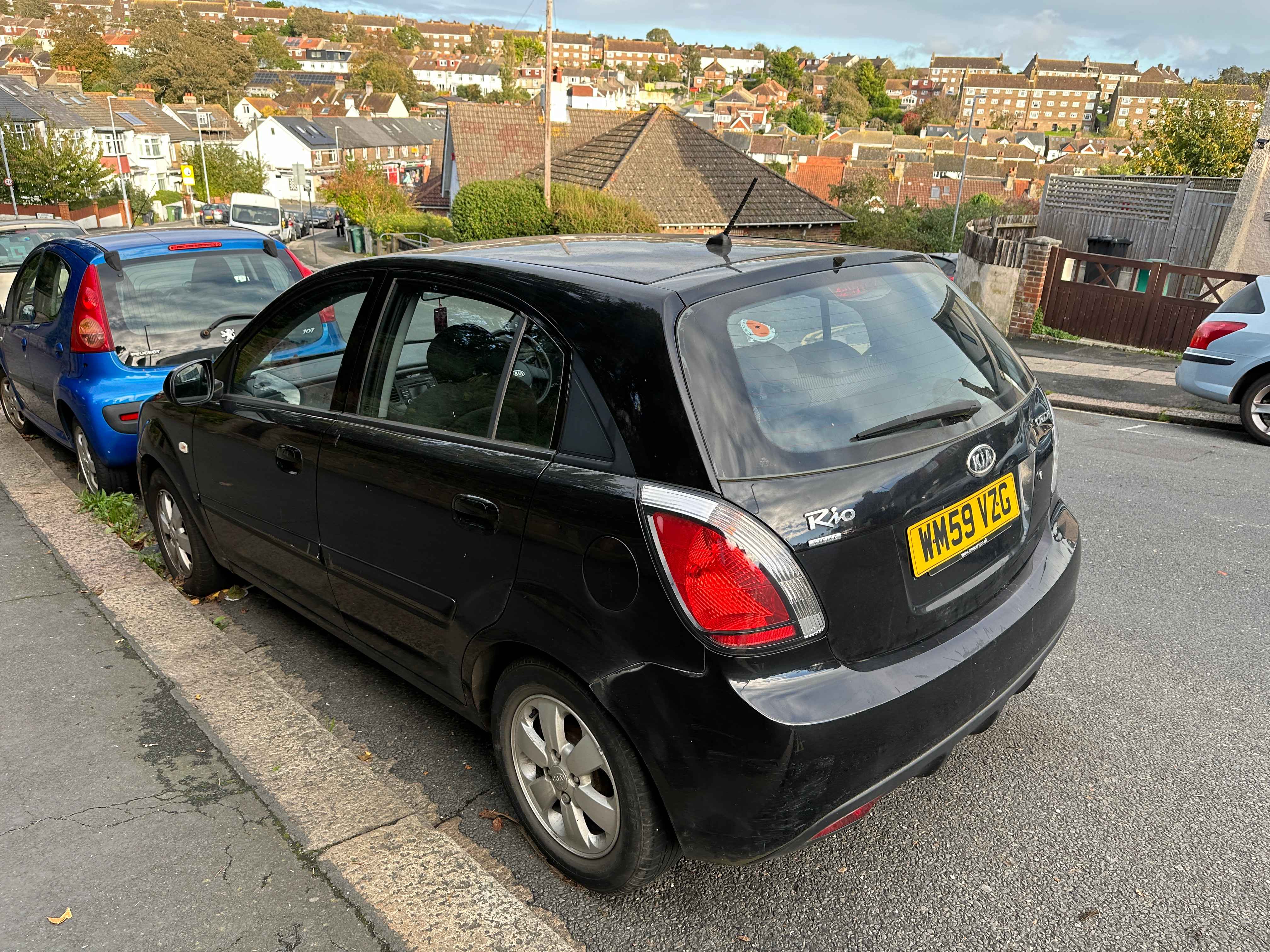 Photograph of WM59 VZG - a Black Kia Rio parked in Hollingdean by a non-resident. The second of four photographs supplied by the residents of Hollingdean.