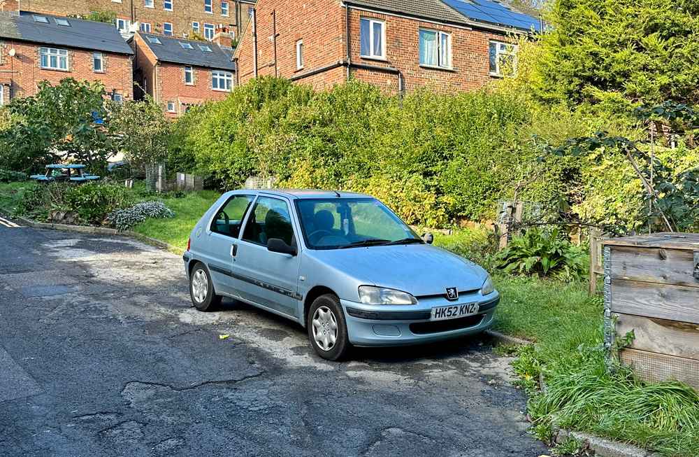 Photograph of HK52 KNZ - a Silver Peugeot 106 parked in Hollingdean by a non-resident, and potentially abandoned. The second of three photographs supplied by the residents of Hollingdean.