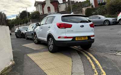 GY15 TXS, a White Kia Sportage parked in Hollingdean