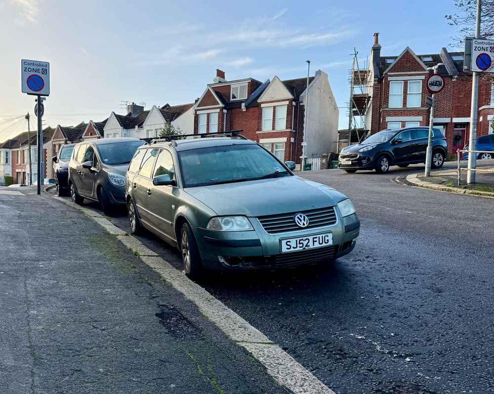 Photograph of SJ52 FUG - a Green Volkswagen Passat parked in Hollingdean by a non-resident, and potentially abandoned. The third of three photographs supplied by the residents of Hollingdean.