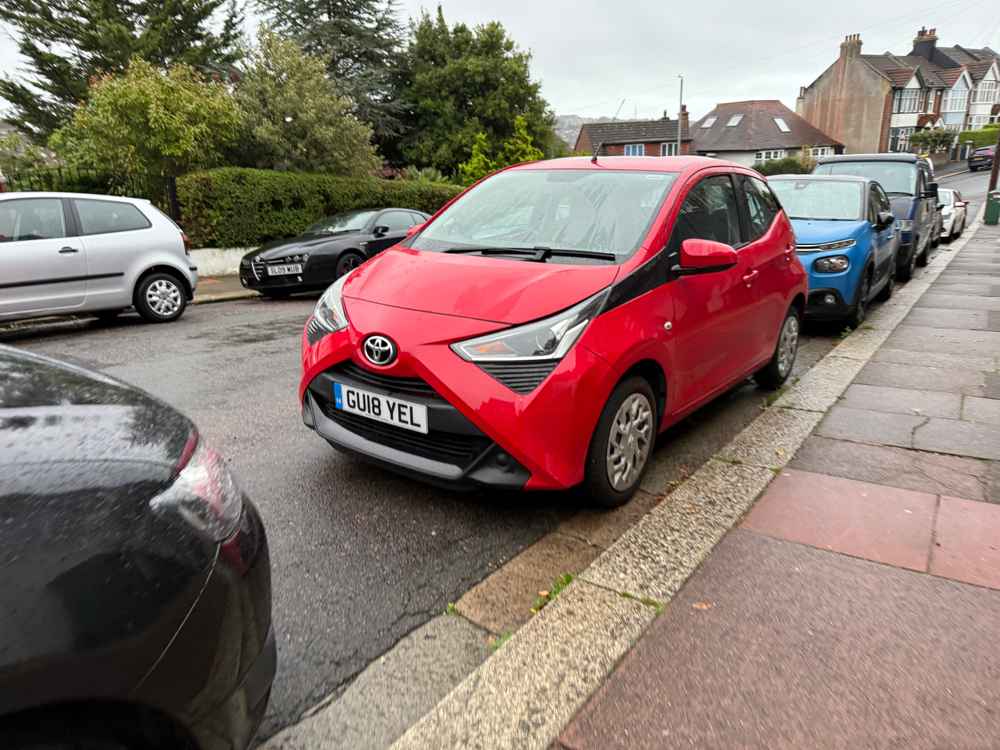 Photograph of GU18 YEL - a Red Toyota Aygo parked in Hollingdean by a non-resident. The sixth of six photographs supplied by the residents of Hollingdean.