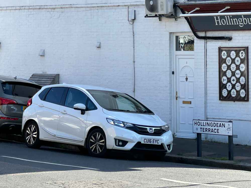 Photograph of CU16 EYC - a White Honda Jazz parked in Hollingdean by a non-resident who uses the local area as part of their Brighton commute. The fourth of four photographs supplied by the residents of Hollingdean.