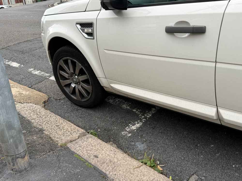 Photograph of AK10 VGZ - a White Land Rover Freelander parked in Hollingdean by a non-resident. The ninth of nine photographs supplied by the residents of Hollingdean.