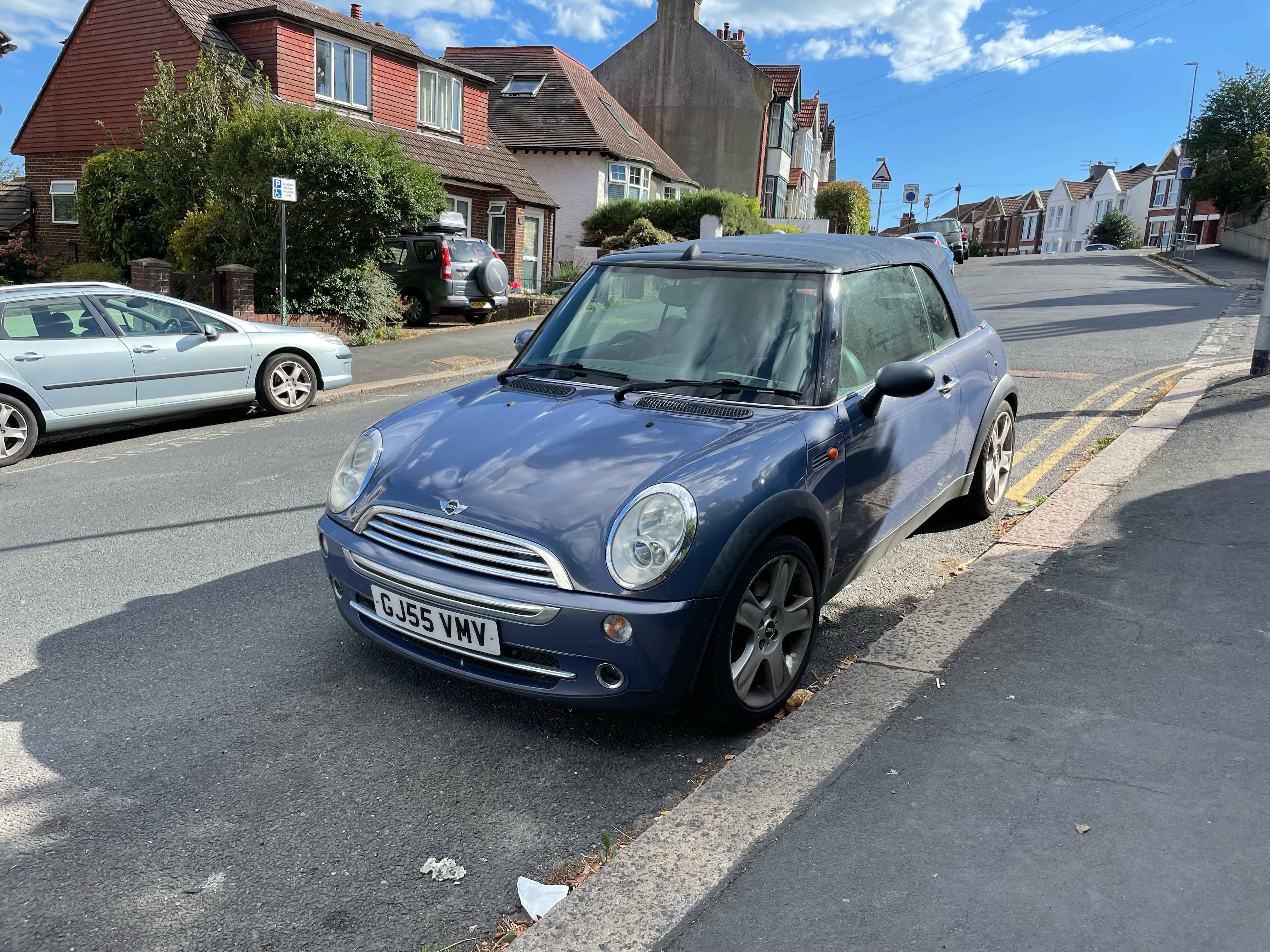 Photograph of GJ55 VMV - a Blue Mini Cooper parked in Hollingdean by a non-resident, and potentially abandoned. 
