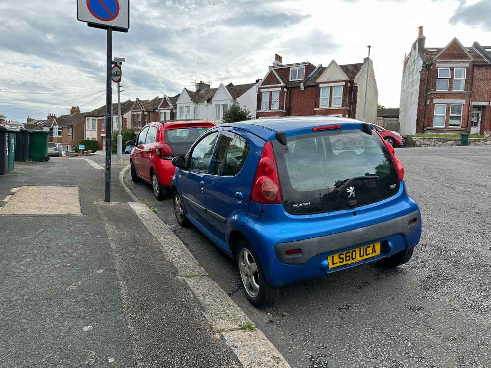 Photograph of LS60 UCA - a Blue Peugeot 107 parked in Hollingdean by a non-resident. The fourteenth of fifteen photographs supplied by the residents of Hollingdean.