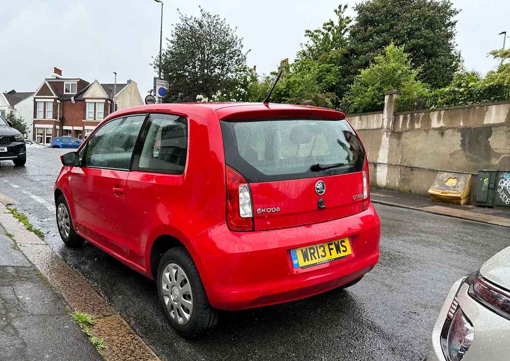 Photograph of WR13 FWS - a Red Skoda Citigo parked in Hollingdean by a non-resident. 