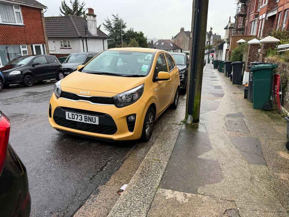 Photograph of LD73 BNU - a Yellow Kia Picanto parked in Hollingdean by a non-resident. The eleventh of twelve photographs supplied by the residents of Hollingdean.