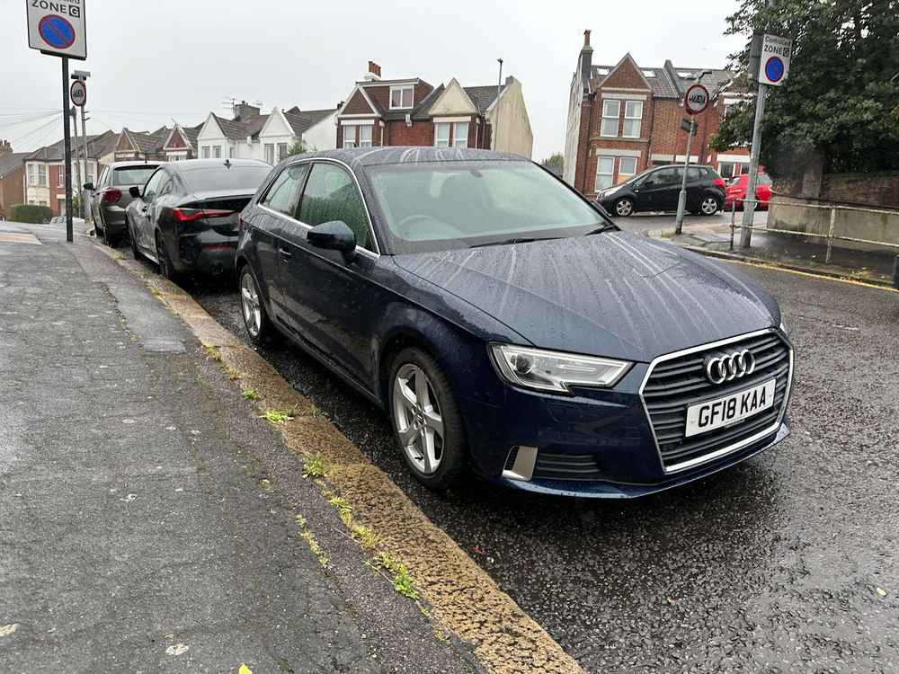 Photograph of GF18 KAA - a Blue Audi A3 parked in Hollingdean by a non-resident. The first of four photographs supplied by the residents of Hollingdean.
