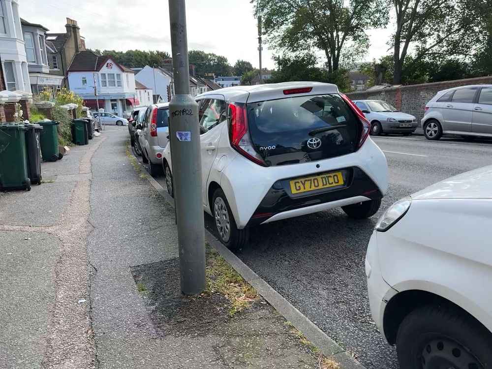 Photograph of GY70 DCO - a White Toyota Aygo parked in Hollingdean by a non-resident. The second of four photographs supplied by the residents of Hollingdean.