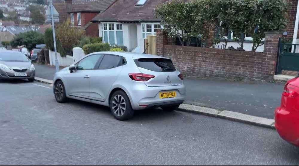 Photograph of MT70 FUJ - a Silver Renault Clio parked in Hollingdean by a non-resident. The sixth of eight photographs supplied by the residents of Hollingdean.