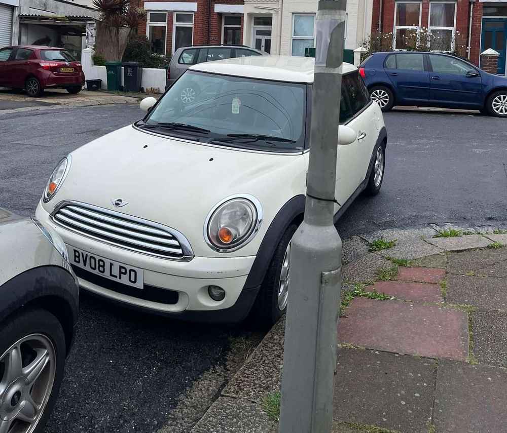 Photograph of BV08 LPO - a White Mini Cooper parked in Hollingdean by a non-resident. The second of two photographs supplied by the residents of Hollingdean.