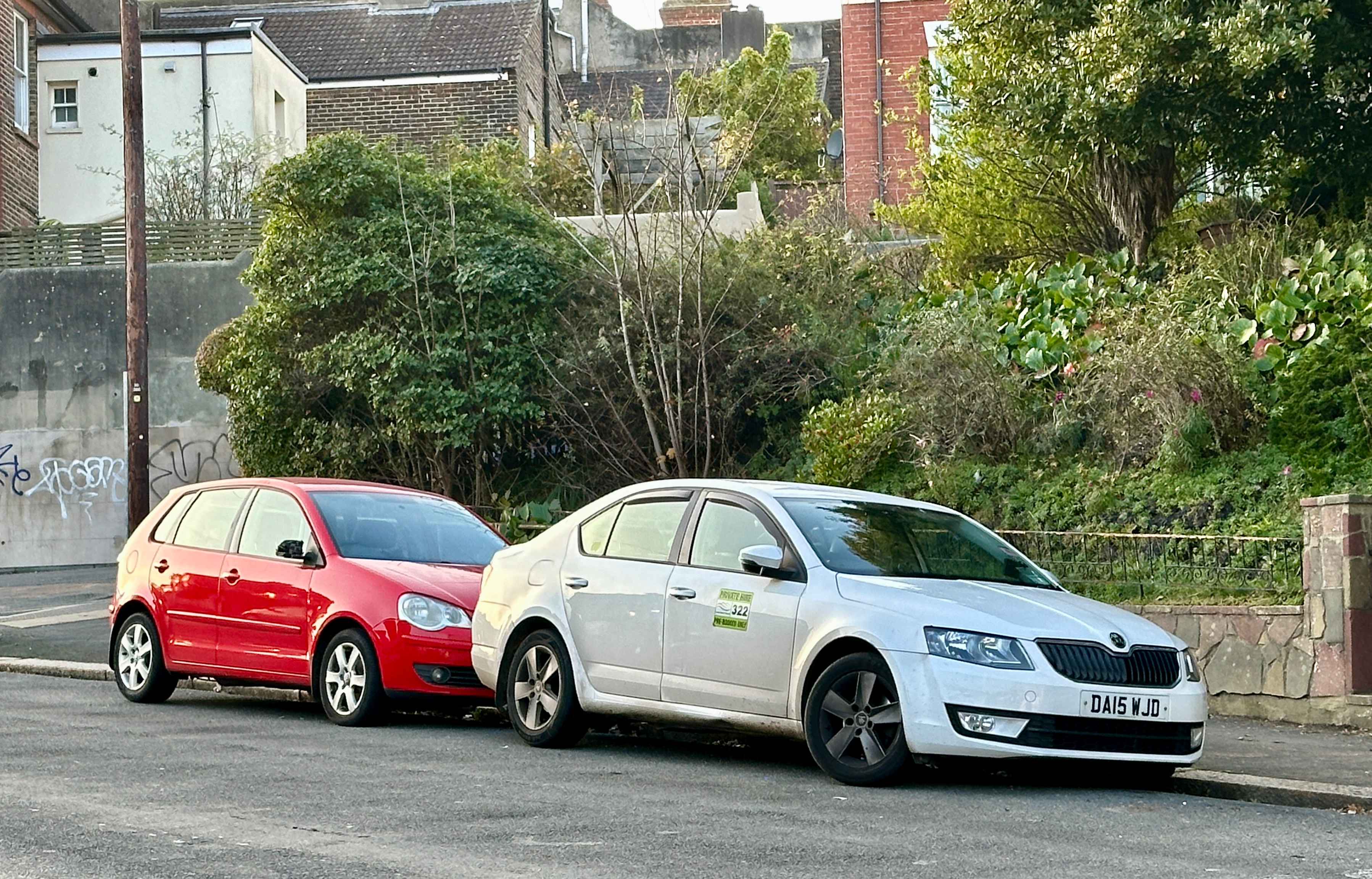 Photograph of DA15 WJD - a White Skoda Octavia taxi parked in Hollingdean by a non-resident. The fourth of five photographs supplied by the residents of Hollingdean.