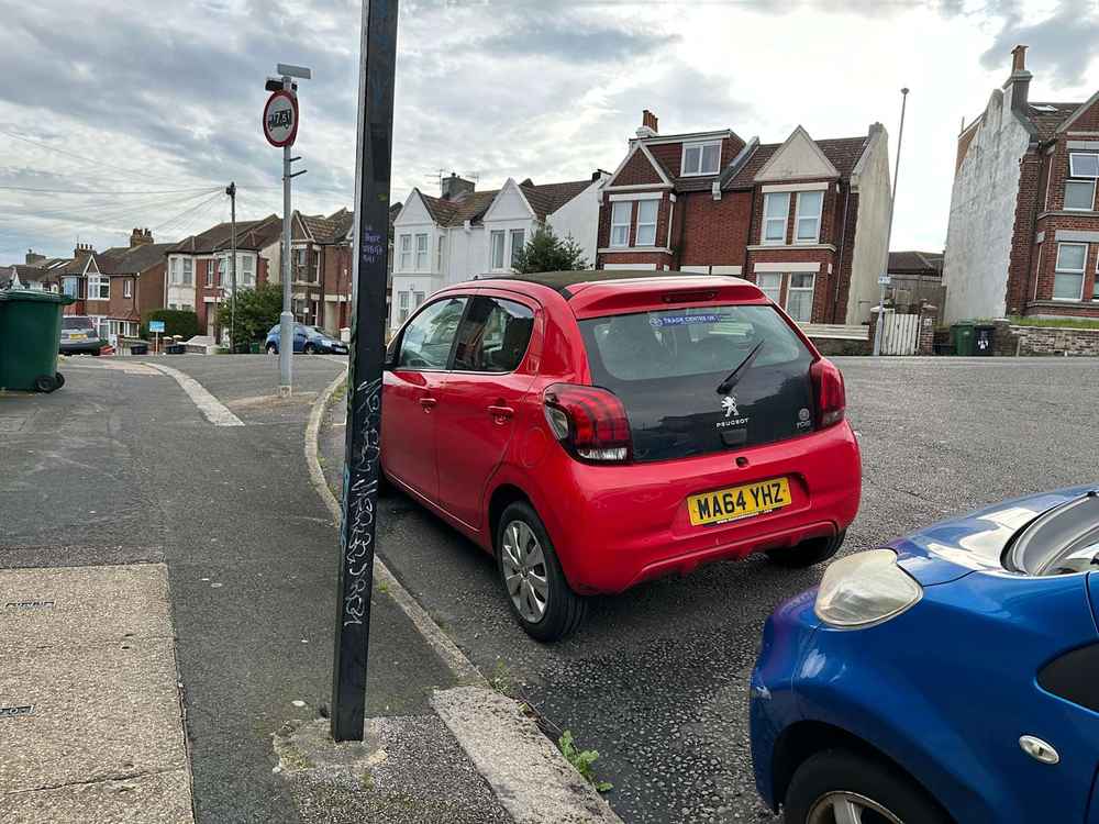Photograph of MA64 YHZ - a Red Peugeot 108 parked in Hollingdean by a non-resident who uses the local area as part of their Brighton commute. The ninth of fourteen photographs supplied by the residents of Hollingdean.