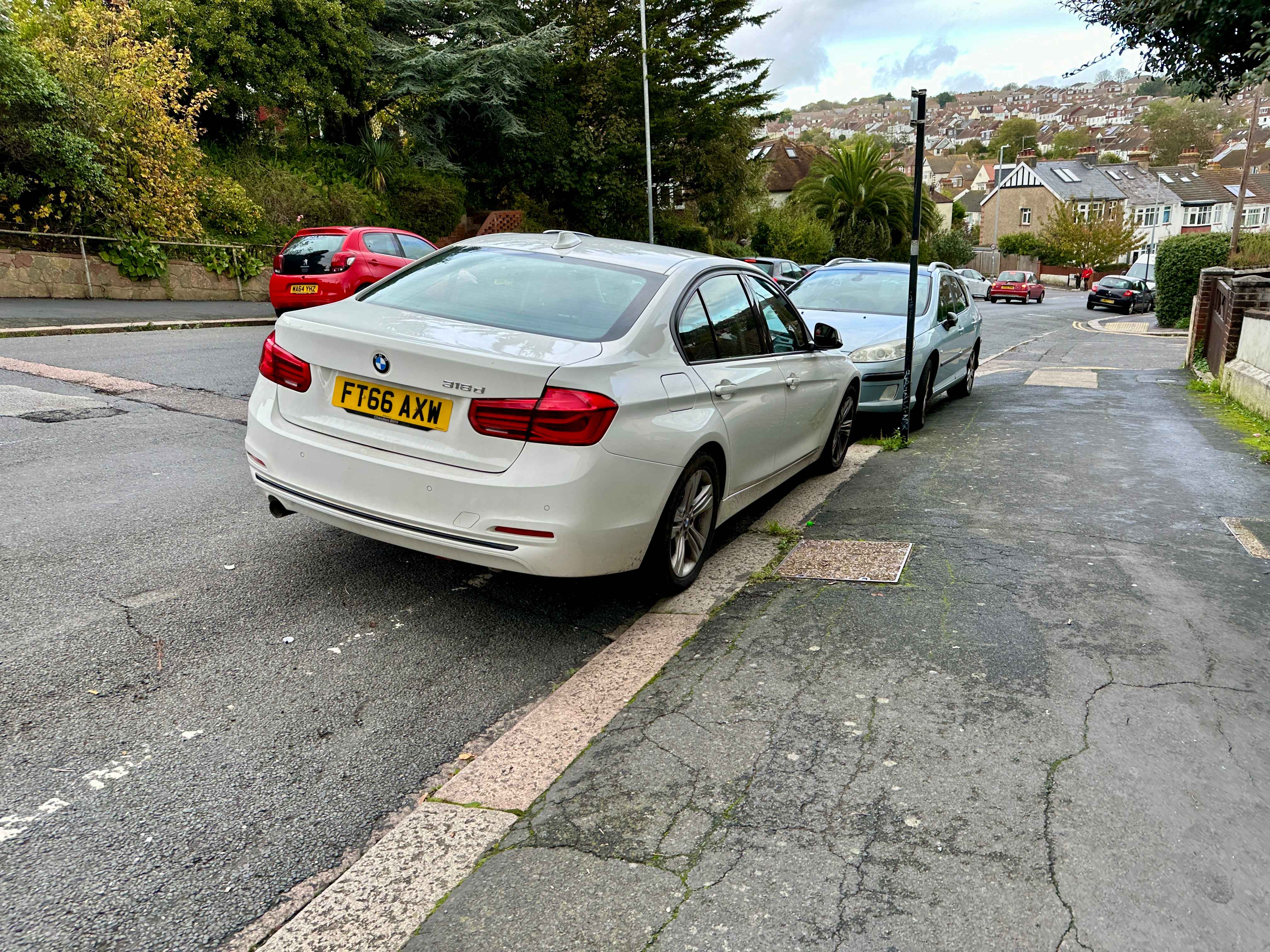 Photograph of FT66 AXW - a White BMW 3 Series parked in Hollingdean by a non-resident who uses the local area as part of their Brighton commute. The third of seven photographs supplied by the residents of Hollingdean.