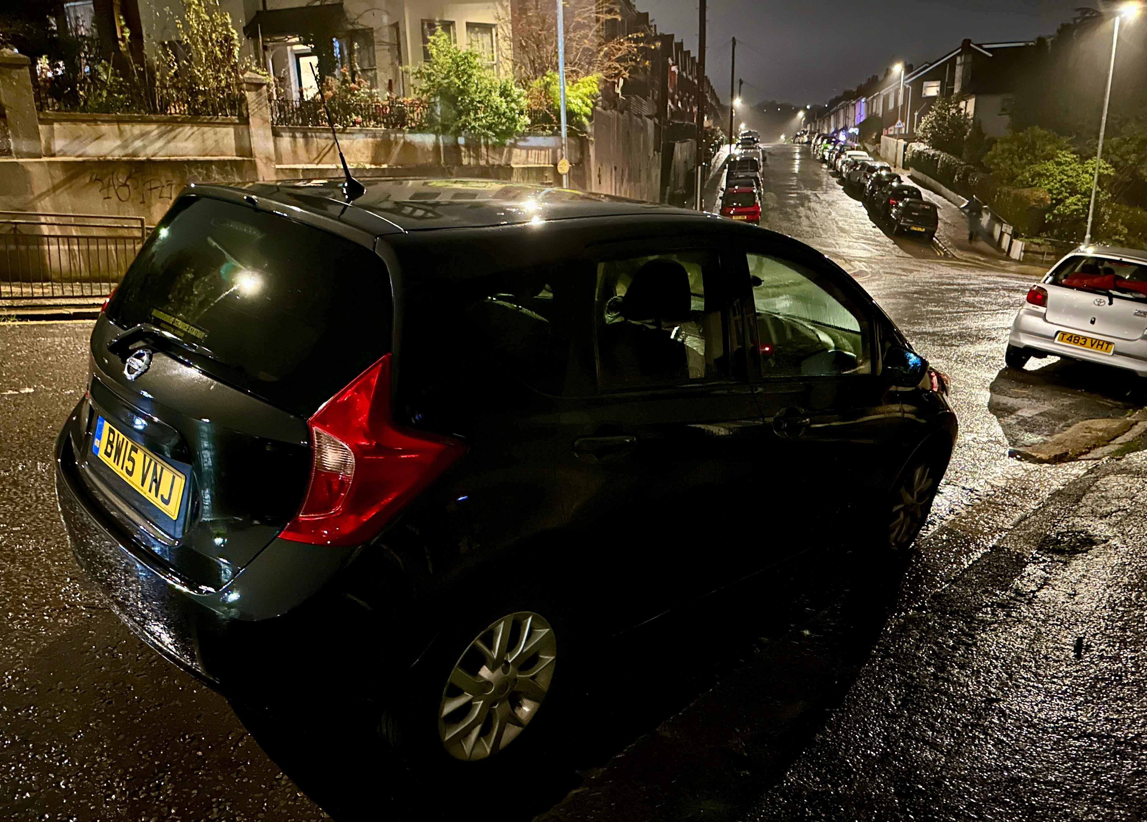 Photograph of BW15 VNJ - a Black Nissan Note parked in Hollingdean by a non-resident who uses the local area as part of their Brighton commute. The thirteenth of fifteen photographs supplied by the residents of Hollingdean.