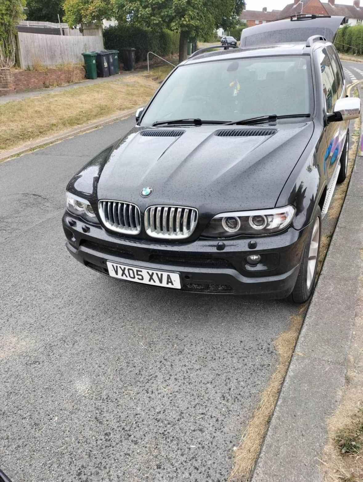 Photograph of VX05 XVA - a Black BMW X5 parked in Hollingdean by a non-resident and stored here whilst a dodgy car dealer attempts to sell it. The first of five photographs supplied by the residents of Hollingdean.