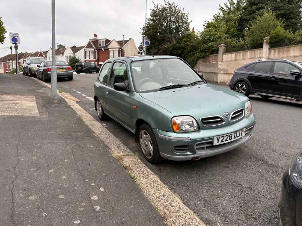 Photograph of Y228 DJT - a Green Nissan Micra parked in Hollingdean by a non-resident, and potentially abandoned. The fourth of four photographs supplied by the residents of Hollingdean.