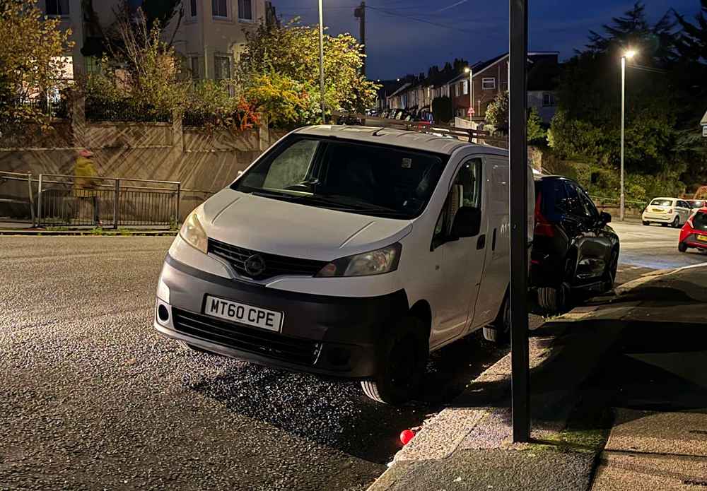 Photograph of MT60 CPE - a White Nissan NV200 parked in Hollingdean by a non-resident, and potentially abandoned. The twelfth of fourteen photographs supplied by the residents of Hollingdean.