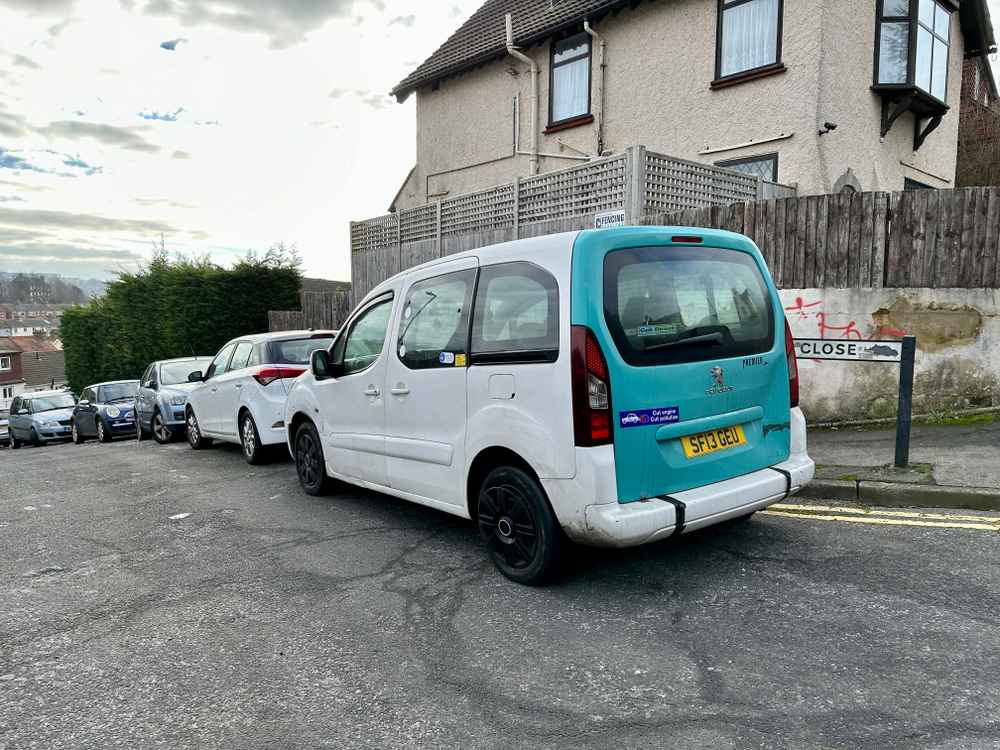 Photograph of SF13 GEU - a White Peugeot Premier taxi parked in Hollingdean by a non-resident, and potentially abandoned. The third of four photographs supplied by the residents of Hollingdean.