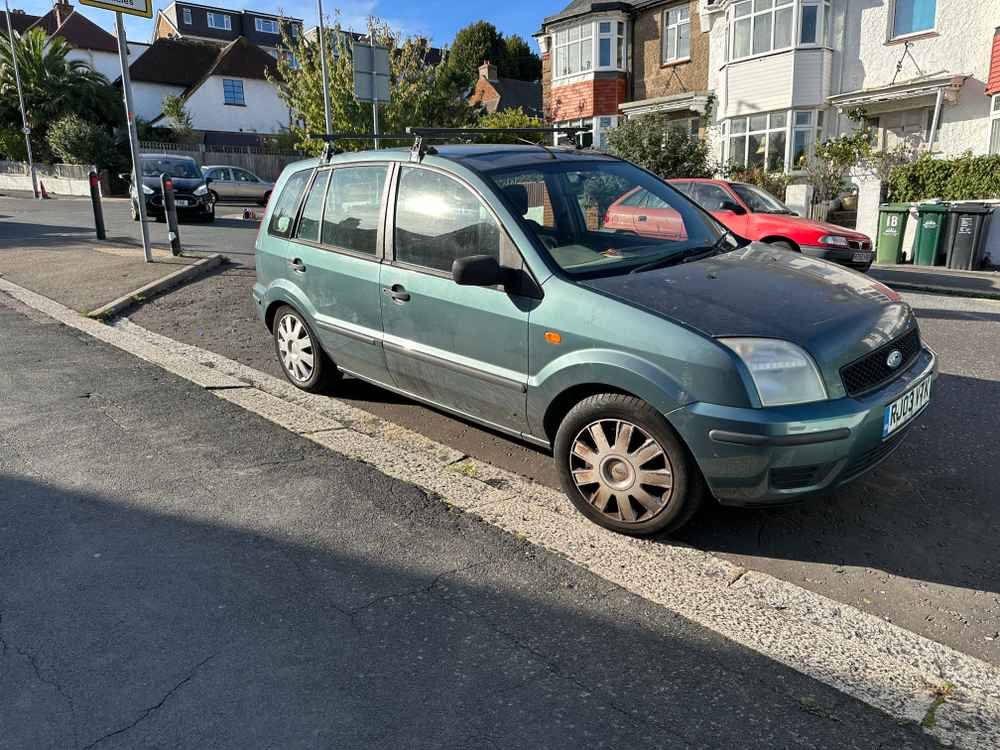 Photograph of RJ03 VTK - a Green Ford Fusion parked in Hollingdean by a non-resident. The third of five photographs supplied by the residents of Hollingdean.