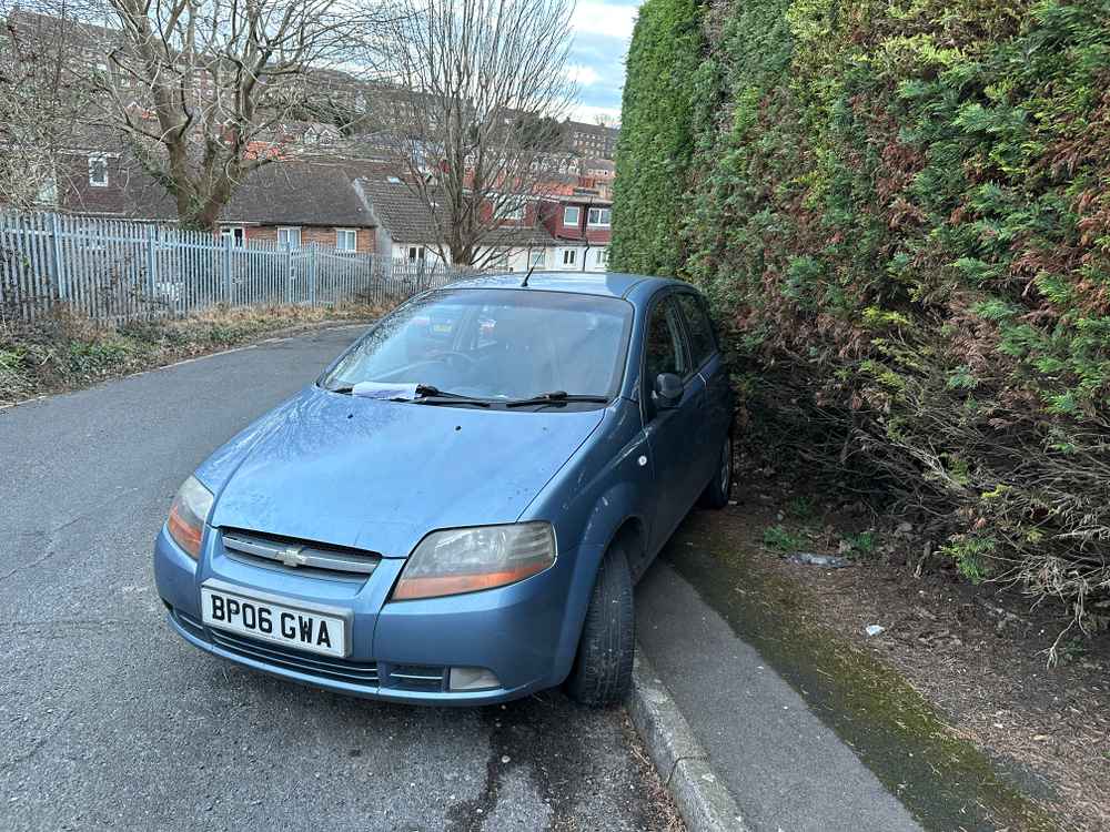 Photograph of BP06 GWA - a Blue Chevrolet Kalos parked in Hollingdean by a non-resident, and potentially abandoned. The first of two photographs supplied by the residents of Hollingdean.