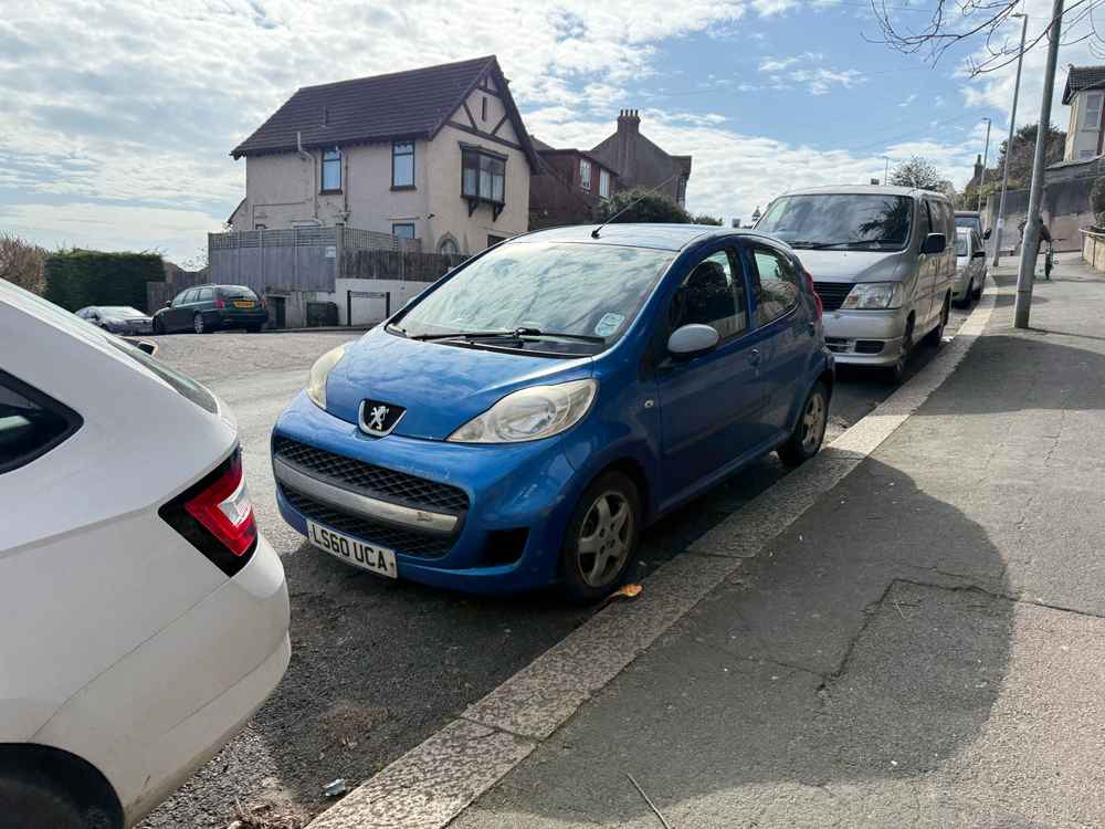 Photograph of LS60 UCA - a Blue Peugeot 107 parked in Hollingdean by a non-resident. The nineteenth of nineteen photographs supplied by the residents of Hollingdean.