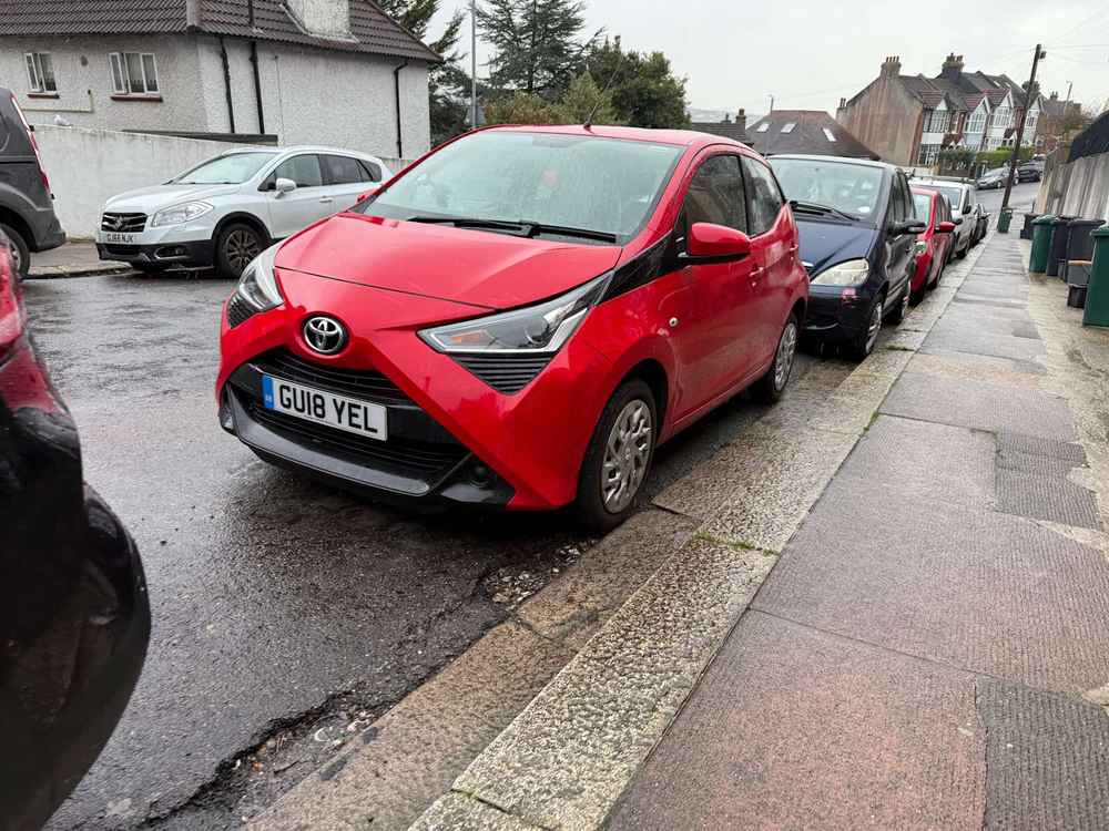 Photograph of GU18 YEL - a Red Toyota Aygo parked in Hollingdean by a non-resident. The tenth of ten photographs supplied by the residents of Hollingdean.