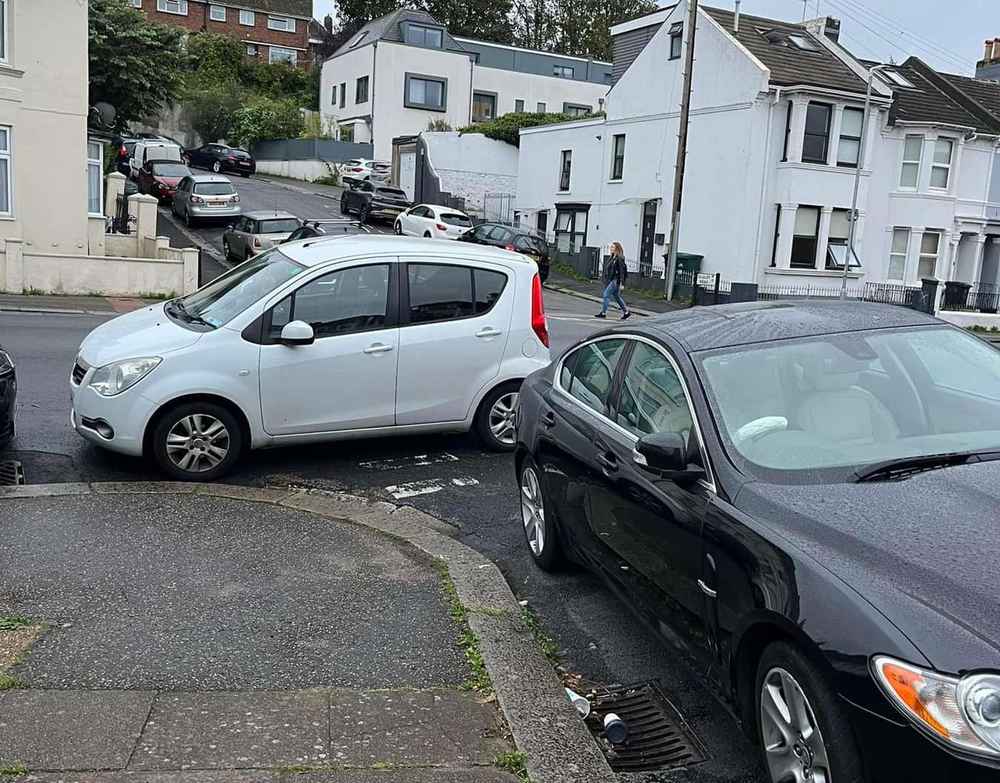 Photograph of HJ12 KVX - a White Vauxhall Agila parked in Hollingdean by a non-resident. The first of two photographs supplied by the residents of Hollingdean.