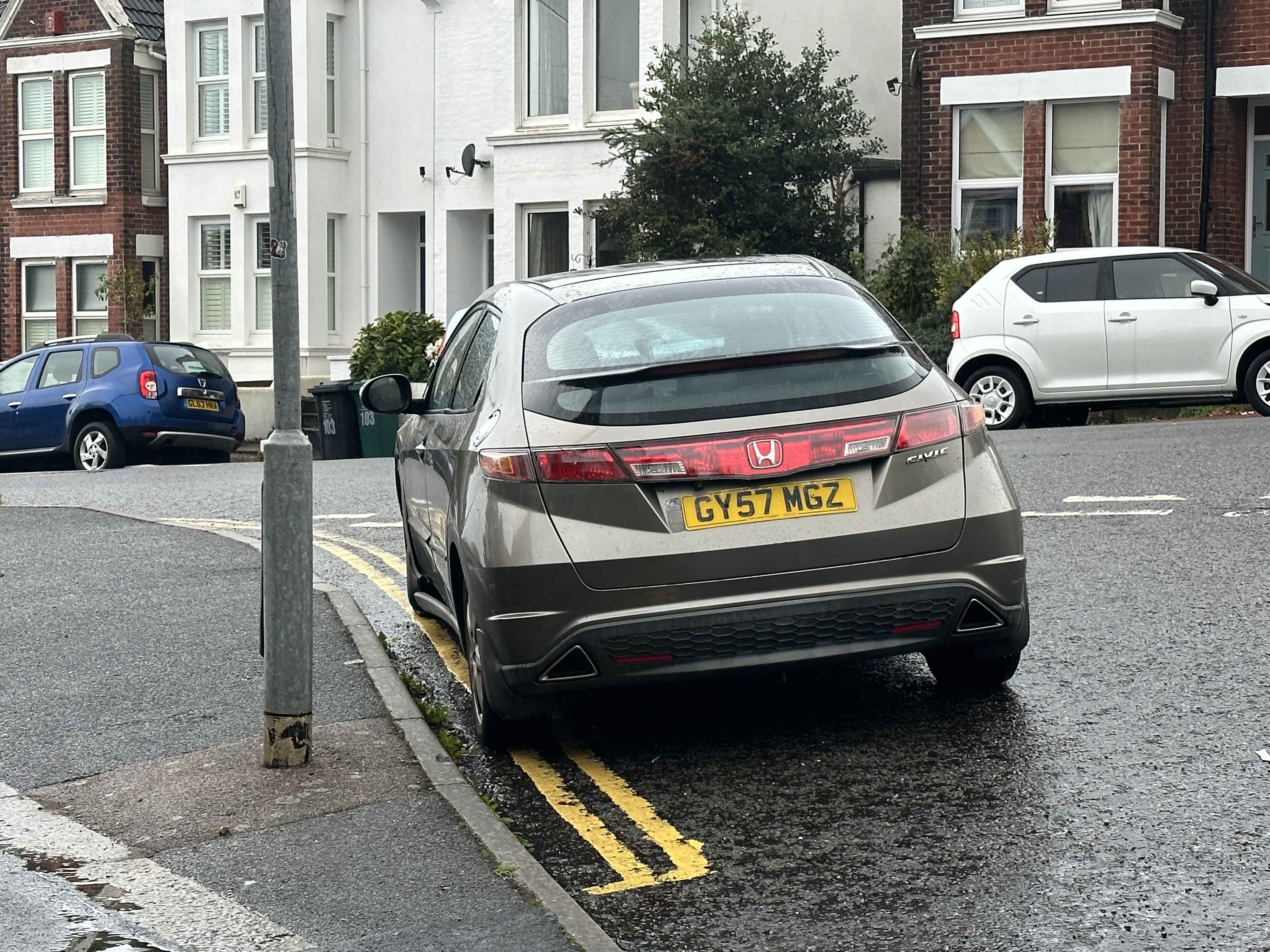 Photograph of GY57 MGZ - a Gold Honda Civic parked in Hollingdean by a non-resident. The first of three photographs supplied by the residents of Hollingdean.