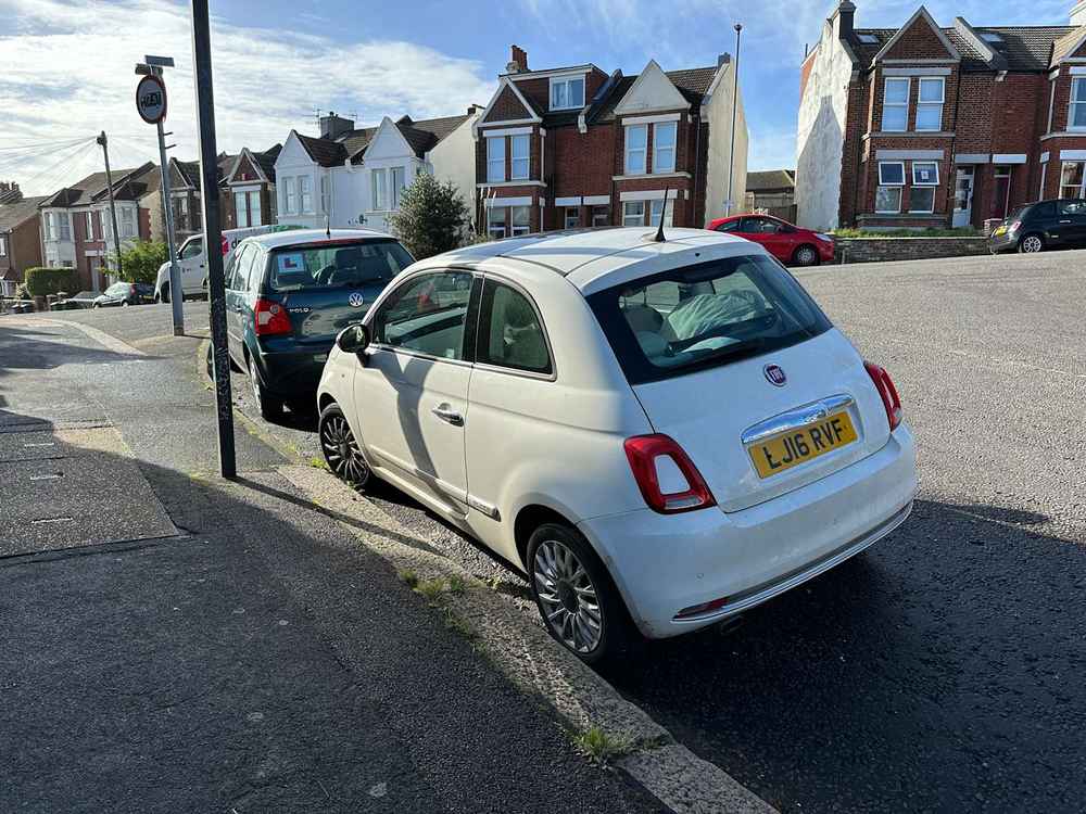 Photograph of LJ16 RVF - a White Fiat 500 parked in Hollingdean by a non-resident. 
