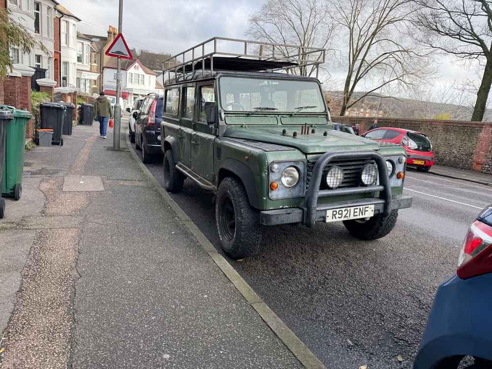 Photograph of R921 ENF - a Green Land Rover Defender parked in Hollingdean by a non-resident. The twelfth of twelve photographs supplied by the residents of Hollingdean.