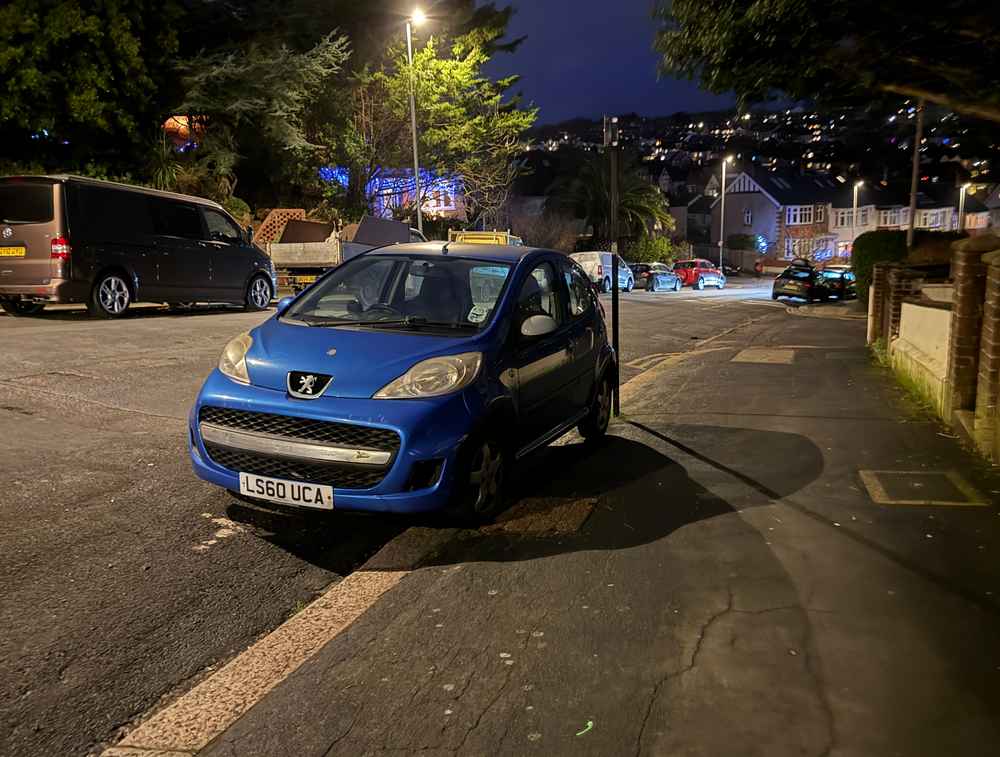 Photograph of LS60 UCA - a Blue Peugeot 107 parked in Hollingdean by a non-resident. The seventeenth of seventeen photographs supplied by the residents of Hollingdean.