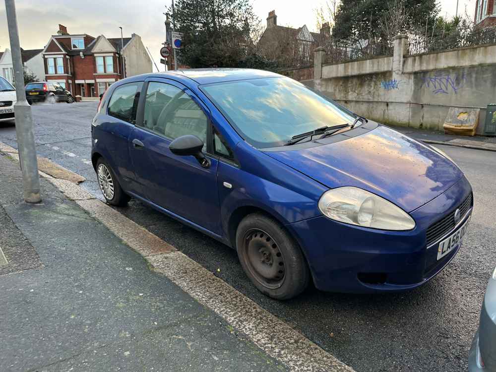 Photograph of LA56 OCP - a Blue Fiat Punto parked in Hollingdean by a non-resident, and potentially abandoned. The third of six photographs supplied by the residents of Hollingdean.