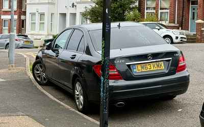 LM63 KMK, a Black Mercedes C Class parked in Hollingdean