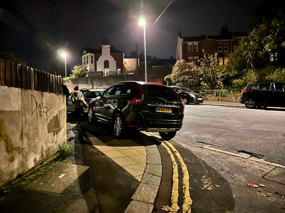 Photograph of DF65 ZZV - a Black Volvo XC60 parked in Hollingdean by a non-resident. The first of eight photographs supplied by the residents of Hollingdean.