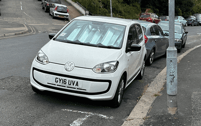 GY16 UVA, a White Volkswagen Up parked in Hollingdean