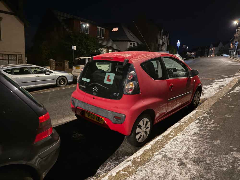 Photograph of YP58 XDF - a Red Citroen C1 parked in Hollingdean by a non-resident, and potentially abandoned. The nineteenth of nineteen photographs supplied by the residents of Hollingdean.