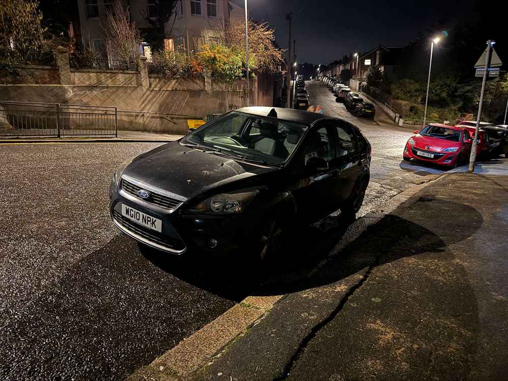 Photograph of WG10 NPK - a Black Ford Focus parked in Hollingdean by a non-resident. The sixteenth of seventeen photographs supplied by the residents of Hollingdean.