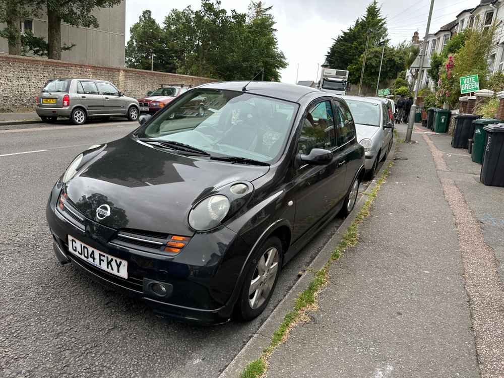 Photograph of GJ04 FKY - a Black Nissan Micra parked in Hollingdean by a non-resident. The fourth of six photographs supplied by the residents of Hollingdean.