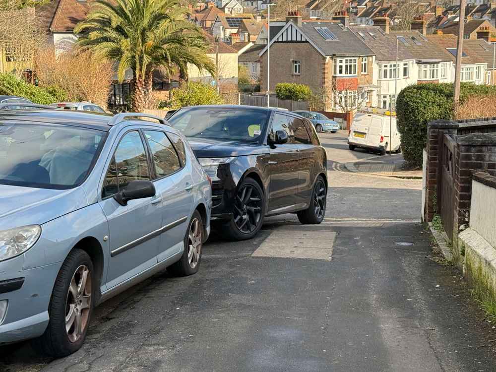 Photograph of LL73 RAX - a Black Land Rover Range Rover parked in Hollingdean by a non-resident. The second of two photographs supplied by the residents of Hollingdean.