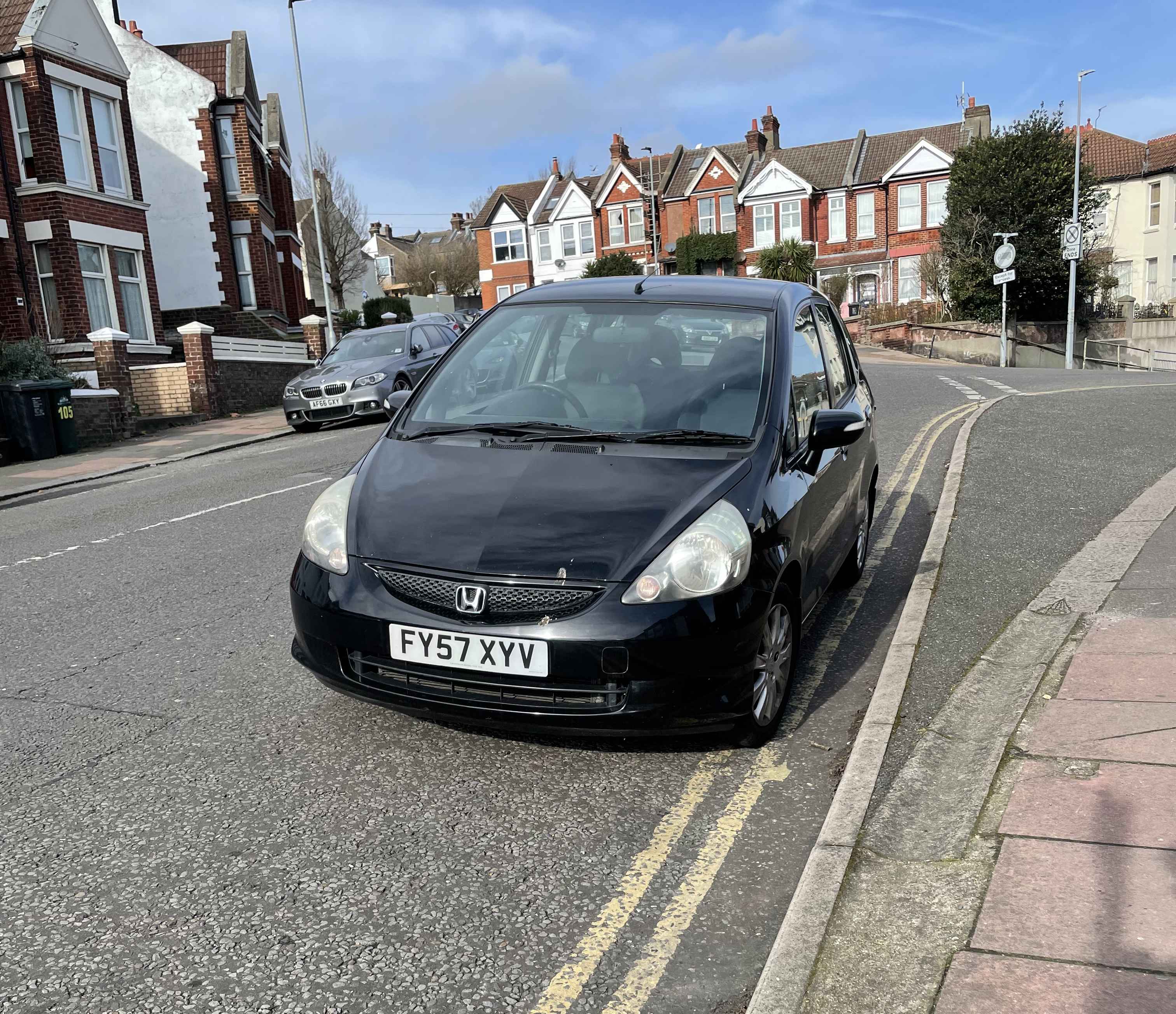 Photograph of FY57 XYV - a Black Honda Jazz parked in Hollingdean by a non-resident. 