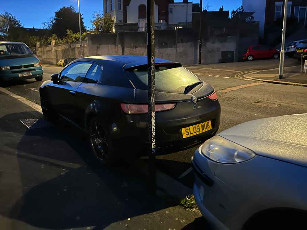 Photograph of SL09 WUB - a Black Alfa Romeo Brera parked in Hollingdean by a non-resident. The second of twenty-six photographs supplied by the residents of Hollingdean.