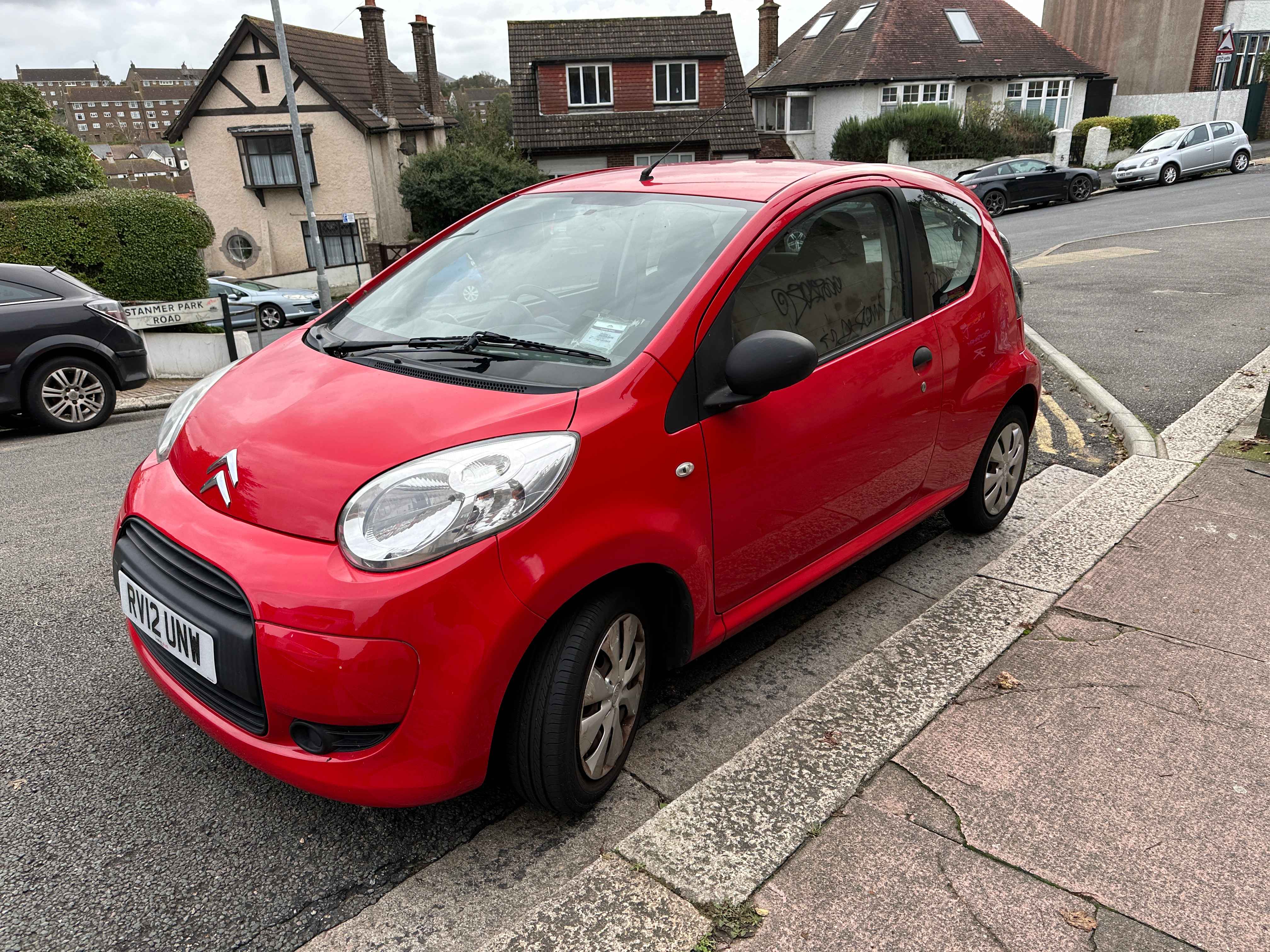 Photograph of RV12 UNW - a Red Citroen C1 parked in Hollingdean by a non-resident. The fourth of four photographs supplied by the residents of Hollingdean.