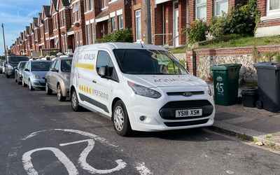 YS18 XSM, a White Ford Transit Connect parked in Hollingdean